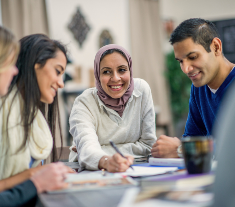 portrait of a women in a hijab at a business meeting.